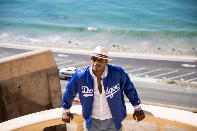 Behind the scenes with Yasiel Puig during his Starter photo shoot. (Photo by Colin Young-Wolff/Invision for Iconix/AP Images)