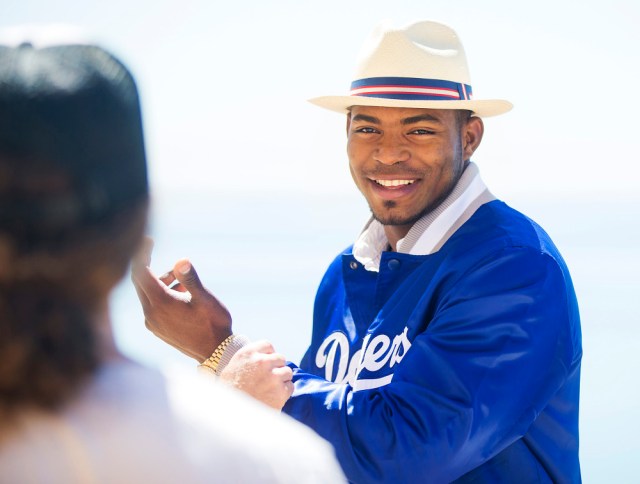 Behind the scenes with Yasiel Puig during his Starter photo shoot. (Photo by Colin Young-Wolff/Invision for Iconix/AP Images)